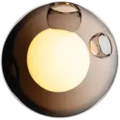 Bocci 28 wall sconce, grey glass sphere, features illuminated inner bulb and brushed nickel mounts against olive green.